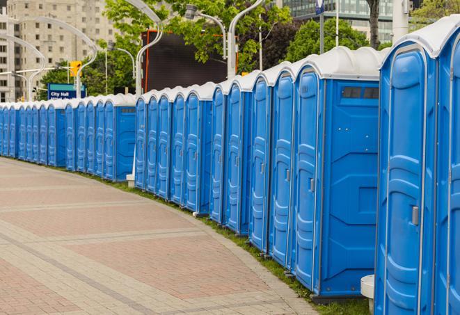 a row of portable restrooms at a fairground, offering visitors a clean and hassle-free experience in mather